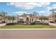 Stately home with lush landscaping, a brick driveway, and classic architectural details at 805 3Rd E St, Palmetto, FL 34221