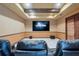 Home theater with tiered seating and large screen at 805 3Rd E St, Palmetto, FL 34221