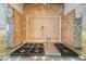 Close-up of gas cooktop with decorative backsplash in a modern kitchen at 805 3Rd E St, Palmetto, FL 34221