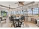 Outdoor lanai with built-in grill, bar seating, and a tranquil garden view at 805 3Rd E St, Palmetto, FL 34221