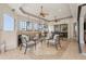 Covered lanai boasting an outdoor kitchen, fireplace, and comfortable seating at 805 3Rd E St, Palmetto, FL 34221
