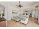 Open-concept living room with modern decor, ceiling fan, and tile flooring at 805 3Rd E St, Palmetto, FL 34221