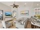 Open concept living space with a TV, couch, breakfast bar and neutral color palette at 805 3Rd E St, Palmetto, FL 34221
