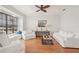Inviting living room featuring a water view, neutral tones, and wood flooring at 805 3Rd E St, Palmetto, FL 34221