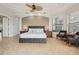 Comfortable bedroom featuring neutral walls, tile floors, and natural light at 805 3Rd E St, Palmetto, FL 34221
