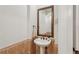 Powder room featuring decorative tile accent and pedestal sink at 805 3Rd E St, Palmetto, FL 34221