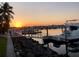 Waterfront at sunset, featuring a view of docks, boats, and reflective water at 805 3Rd E St, Palmetto, FL 34221