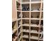 Spacious wine cellar with diverse collection and well-organized wooden shelves at 805 3Rd E St, Palmetto, FL 34221