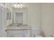 Bathroom with white cabinetry, stone countertop, and modern fixtures at 920 Tidewater Shores Loop # 304, Bradenton, FL 34208