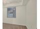 Bright bedroom featuring a ceiling fan and large window with blinds at 920 Tidewater Shores Loop # 304, Bradenton, FL 34208