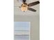 Close up of a bedroom with a ceiling fan and water view at 920 Tidewater Shores Loop # 304, Bradenton, FL 34208
