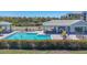 Community pool area with covered seating, lounge chairs and a sparkling pool at 920 Tidewater Shores Loop # 304, Bradenton, FL 34208