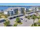 Condominium exterior featuring ample covered parking and lush landscaping near the waterfront at 920 Tidewater Shores Loop # 304, Bradenton, FL 34208