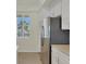 Bright kitchen features stainless steel appliances, white cabinetry and ample storage at 920 Tidewater Shores Loop # 304, Bradenton, FL 34208