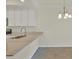 Close up of the kitchen, showing granite counters and dining area at 920 Tidewater Shores Loop # 304, Bradenton, FL 34208