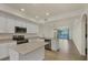 Open concept kitchen boasts stainless steel appliances, granite counters, and a water view at 920 Tidewater Shores Loop # 304, Bradenton, FL 34208