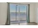 Light-filled living area with access to a balcony overlooking scenic waterfront views at 920 Tidewater Shores Loop # 304, Bradenton, FL 34208