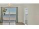 Spacious living area with sliding glass doors leading to a waterfront balcony at 920 Tidewater Shores Loop # 304, Bradenton, FL 34208