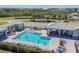 Community pool features ample seating, cabana, and a clear blue swimming pool perfect for relaxation and fun at 920 Tidewater Shores Loop # 304, Bradenton, FL 34208