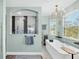 A serene bathroom with a soaking tub and walk-in rainfall shower at 9902 284Th St E E St, Myakka City, FL 34251
