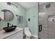 Beautiful bathroom featuring a modern vanity and decorative tiled shower at 9902 284Th St E E St, Myakka City, FL 34251