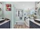 The bathroom has separate vanities, a freestanding tub, and a rainfall shower at 9902 284Th St E E St, Myakka City, FL 34251