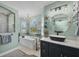 This brightly lit bathroom has a modern tub, walk-in shower, and a vessel sink at 9902 284Th St E E St, Myakka City, FL 34251