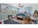A peaceful bedroom with plenty of natural light, desk, and colorful rug at 9902 284Th St E E St, Myakka City, FL 34251
