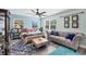 Light filled main bedroom with sitting area, ceiling fan and decorative rug at 9902 284Th St E E St, Myakka City, FL 34251