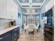 An eye-catching chandelier illuminates the dining room with a wine cooler at 9902 284Th St E E St, Myakka City, FL 34251