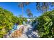Inviting backyard fire pit surrounded by chairs and lush greenery for outdoor relaxation and entertainment at 9902 284Th St E E St, Myakka City, FL 34251