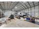 Spacious garage interior with high ceilings and ample storage space, perfect for RV parking, workshop, or hobbies at 9902 284Th St E E St, Myakka City, FL 34251