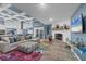 Bright living room with fireplace and comfortable couch with colorful rug at 9902 284Th St E E St, Myakka City, FL 34251
