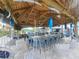 Outdoor bar area with seating and thatched roof, perfect for entertaining by the pool at 9902 284Th St E E St, Myakka City, FL 34251