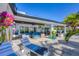 Spacious patio featuring comfortable lounge chairs and vibrant tropical plants at 9902 284Th St E E St, Myakka City, FL 34251