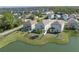Aerial view of the back of a home overlooking a pond, featuring a fenced backyard and outdoor seating at 108 San Avellino Ct, Bradenton, FL 34208