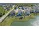 Aerial view of homes overlooking a pond and green space featuring a fenced backyard and outdoor seating at 108 San Avellino Ct, Bradenton, FL 34208