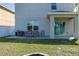 This backyard includes a patio, an outdoor dining set, and a fire pit at 108 San Avellino Ct, Bradenton, FL 34208