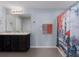 Bathroom features a double sink vanity, shower with curtain, and neutral wall colors at 108 San Avellino Ct, Bradenton, FL 34208