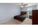 Comfortable bedroom with a window view and carpet flooring at 108 San Avellino Ct, Bradenton, FL 34208