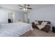 Large bedroom featuring a ceiling fan, and seating area at 108 San Avellino Ct, Bradenton, FL 34208