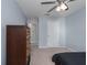 Spacious bedroom featuring a ceiling fan, closet space, and neutral color palette at 108 San Avellino Ct, Bradenton, FL 34208