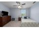 Charming bedroom featuring a ceiling fan and a scenic view of the lake at 108 San Avellino Ct, Bradenton, FL 34208