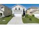 Charming two-story home with a balcony, manicured lawn, and a two car garage at 108 San Avellino Ct, Bradenton, FL 34208