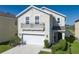 Charming two-story home with a balcony, two-car garage and landscaped yard at 108 San Avellino Ct, Bradenton, FL 34208