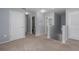 Upstairs hallway with carpet flooring leads to the bedrooms and bathroom at 108 San Avellino Ct, Bradenton, FL 34208