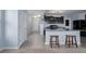 Charming kitchen with granite countertops, black appliances, and a convenient breakfast bar at 108 San Avellino Ct, Bradenton, FL 34208