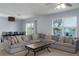 Inviting living room with a large sectional sofa, water view, and a cozy ambiance at 108 San Avellino Ct, Bradenton, FL 34208