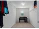 Bright walk-in closet with white walls, carpeted floor, shelving, and a small desk and window at 108 San Avellino Ct, Bradenton, FL 34208