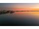 Panoramic waterfront view showcasing the city skyline and tranquil waters at sunset at 1051 Indian Beach Dr, Sarasota, FL 34234